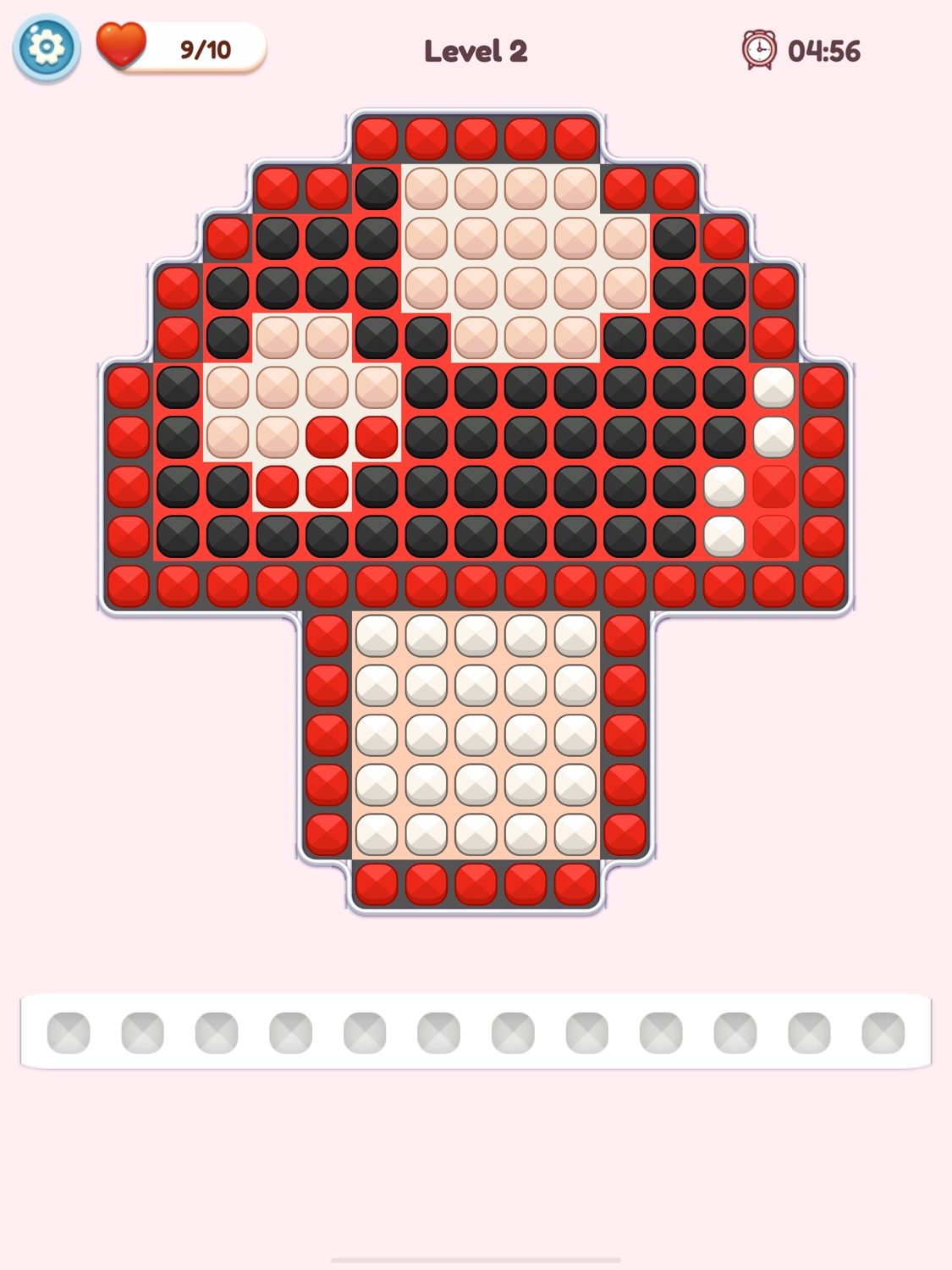 A colorful bead-art heart puzzle in Jewel Garden